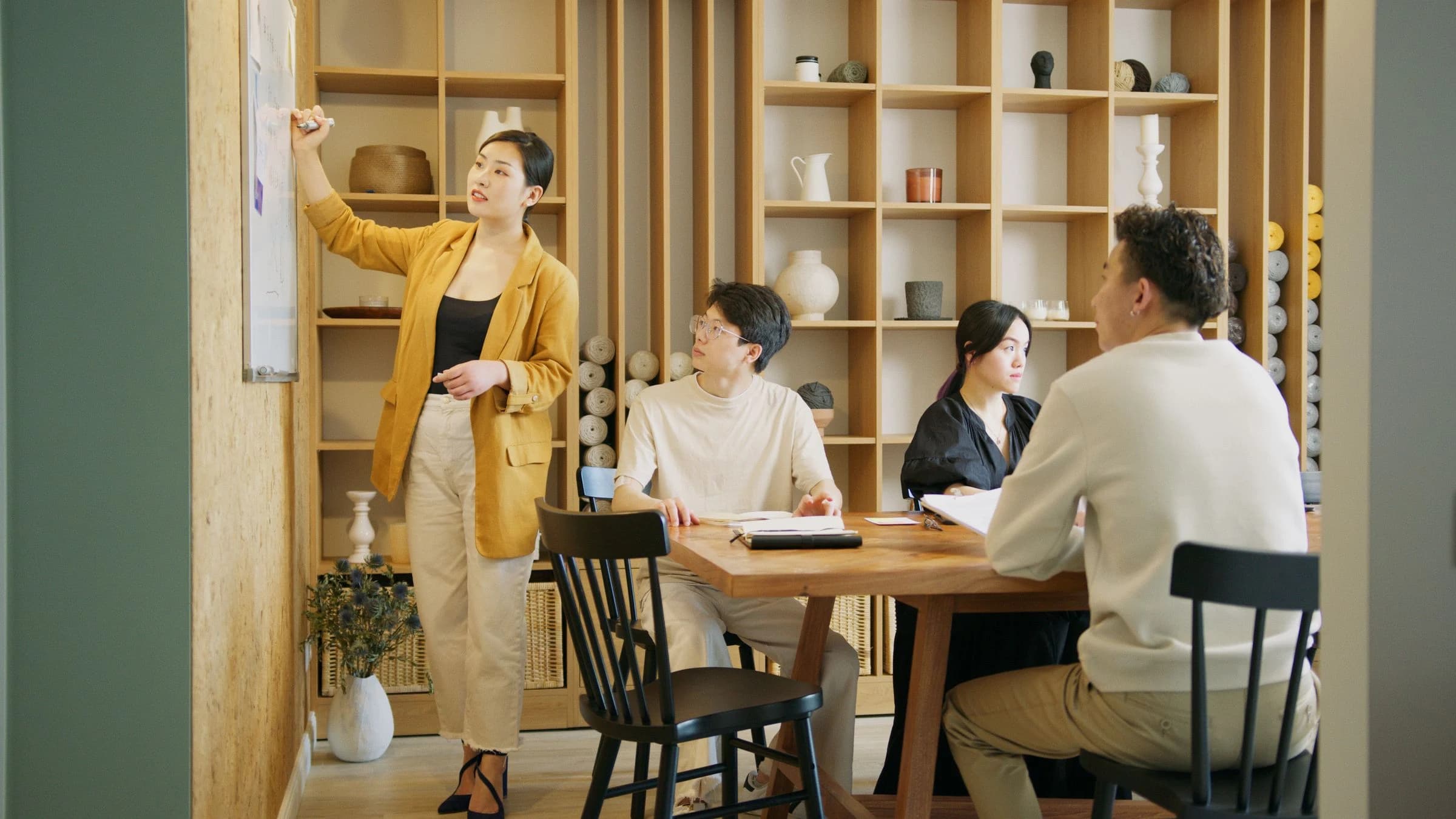 Colleagues collaborating across a shared workplace